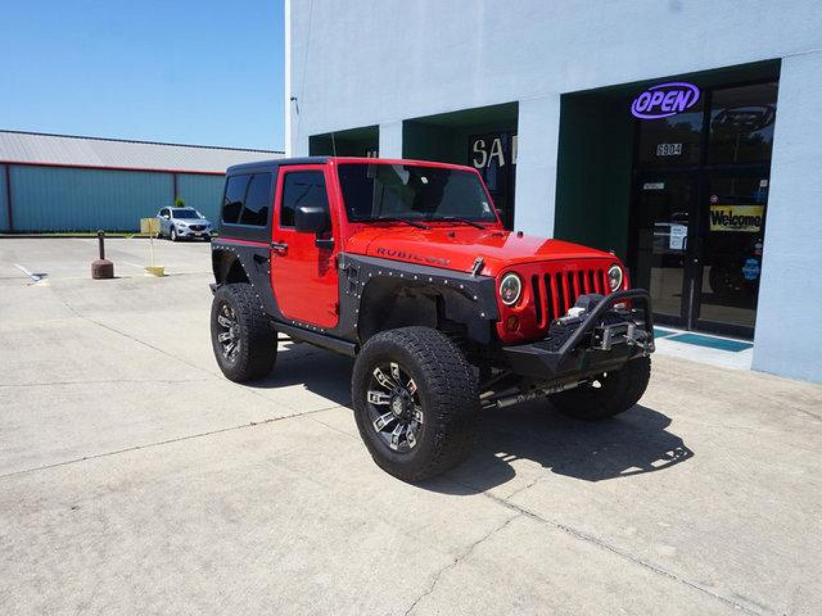 2012 Red Jeep Wrangler (1C4BJWCG9CL) with an 3.6L V6 engine, 6 Spd Automatic transmission, located at 6904 Johnston St., Lafayette, LA, 70503, (337) 988-1960, 30.143589, -92.100601 - beautiful Jeep Prices are subject to change as improvements done by the service dept. Prices are for Cash sales only, Plus TTL. This Vehicle is Serviced well and Warranties Available too. Easy Financing. Drives Great and everything works. Price subject to change as improvements done by the servi - Photo #1