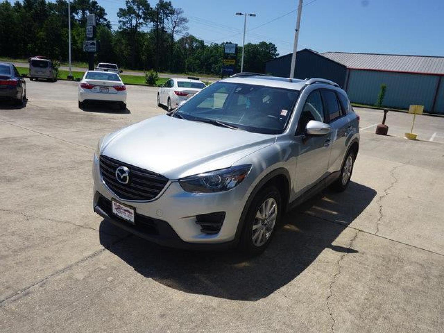 2016 Sonic Silver Metallic /Black Mazda CX-5 FWD 4dr Auto Touring (JM3KE2CY8G0) with an 2.5L 4Cyl engine, Automatic transmission, located at 6904 Johnston St., Lafayette, LA, 70503, (337) 988-1960, 30.143589, -92.100601 - Photo#5