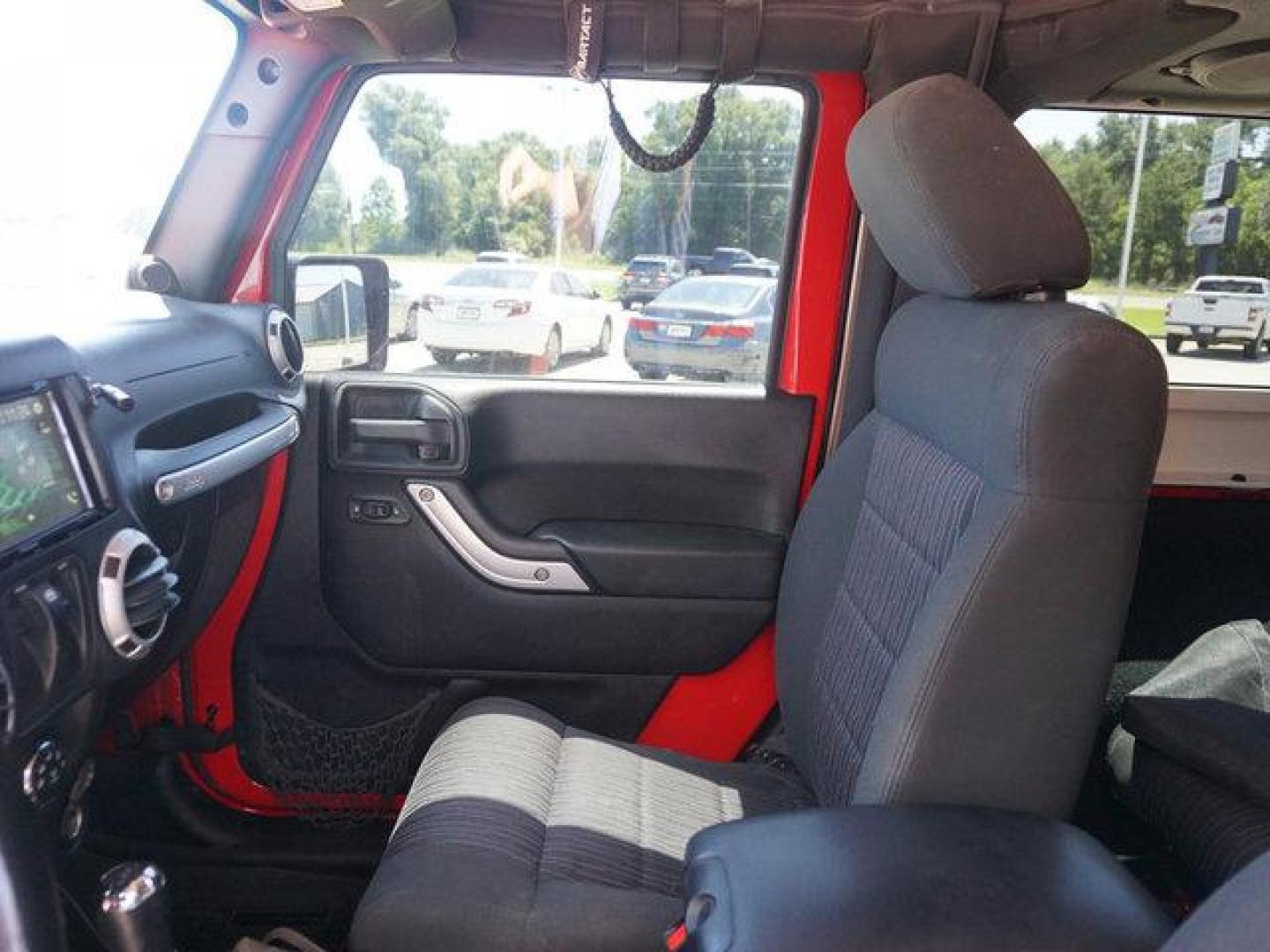 2012 Red Jeep Wrangler (1C4BJWCG9CL) with an 3.6L V6 engine, 6 Spd Automatic transmission, located at 6904 Johnston St., Lafayette, LA, 70503, (337) 988-1960, 30.143589, -92.100601 - beautiful Jeep Prices are subject to change as improvements done by the service dept. Prices are for Cash sales only, Plus TTL. This Vehicle is Serviced well and Warranties Available too. Easy Financing. Drives Great and everything works. Price subject to change as improvements done by the servi - Photo#21