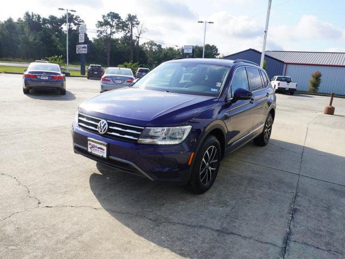 2021 Blue Volkswagen Tiguan (3VV3B7AX7MM) with an 2.0L 4Cyl engine, 8 Spd Automatic transmission, located at 6904 Johnston St., Lafayette, LA, 70503, (337) 988-1960, 30.143589, -92.100601 - Prices are subject to change as improvements done by the service dept. Prices are for Cash sales only, Plus TTL. This Vehicle is Serviced well and Warranties Available too. Easy Financing. Drives Great and everything works. Price subject to change as improvements done by the service dept. Easy CR - Photo#4